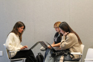 3 girls working on laptops